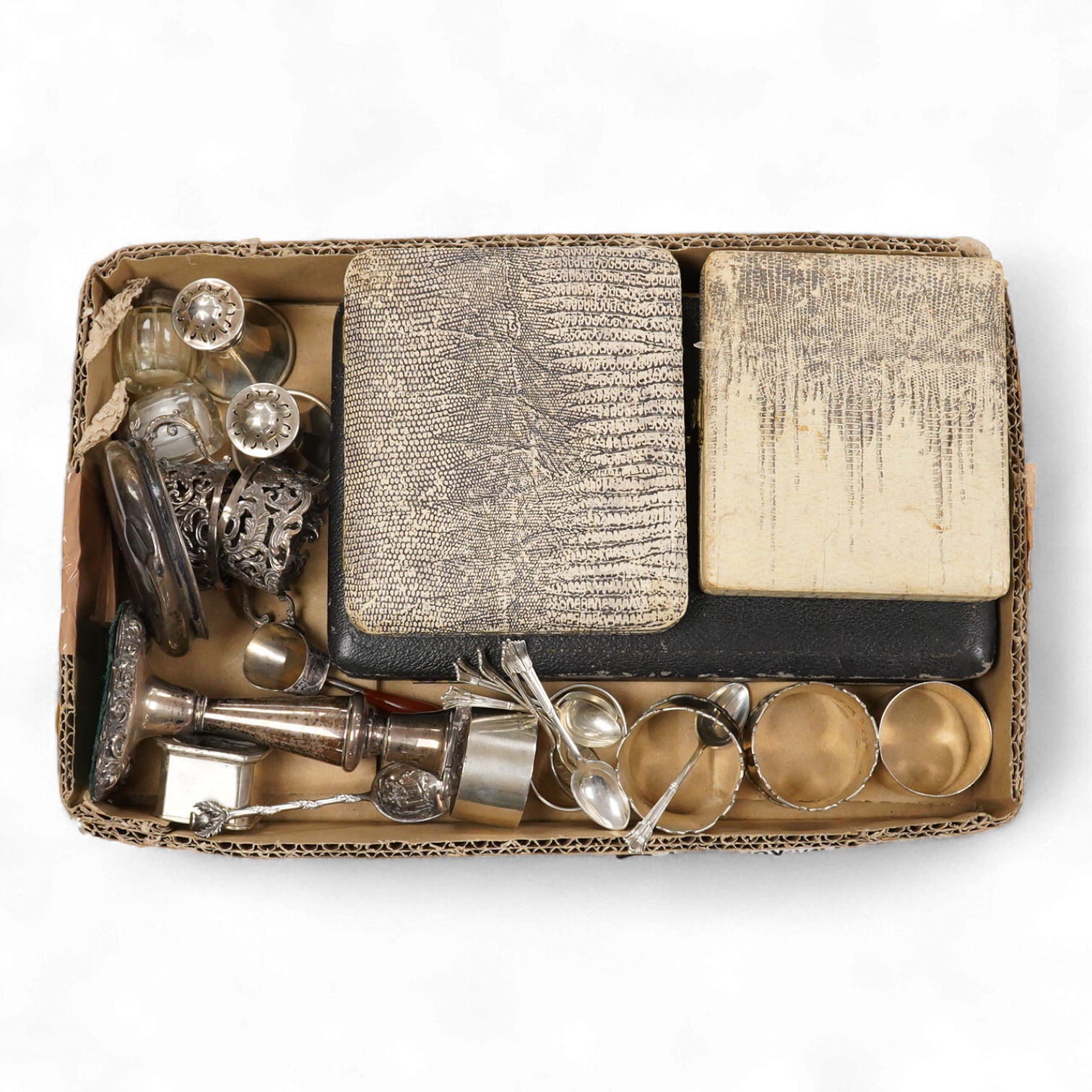 A collection of assorted silver to include five napkin rings including two pairs, a cased pair of glass butter dishes with silver butter knives, five golf related teaspoons, a cased set of six sterling cocktail sticks wi